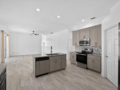 Located in a gated golf course community, 411 Boxwood Dr has on Ridgewood Lakes Golf and Country Club in Florida - for sale on GolfHomes.com, golf home, golf lot