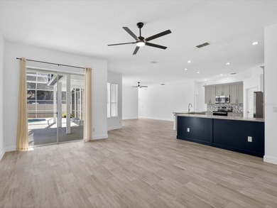 Located in a gated golf course community, 411 Boxwood Dr has on Ridgewood Lakes Golf and Country Club in Florida - for sale on GolfHomes.com, golf home, golf lot