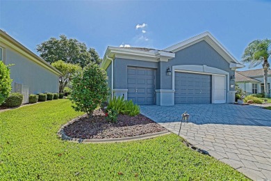 Stunning home loaded with upgrades on a deep semi-private lot on Eagle Ridge At Spruce Creek Country Club in Florida - for sale on GolfHomes.com, golf home, golf lot
