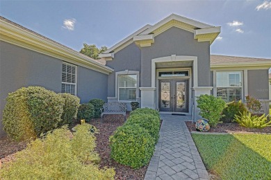 Stunning home loaded with upgrades on a deep semi-private lot on Eagle Ridge At Spruce Creek Country Club in Florida - for sale on GolfHomes.com, golf home, golf lot