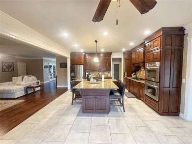 Luxurious 6 bedroom, 4.5 bath home on the 5th hole of Riverlinks on Tahlequah City Golf Course in Oklahoma - for sale on GolfHomes.com, golf home, golf lot