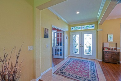 Stunning home loaded with upgrades on a deep semi-private lot on Eagle Ridge At Spruce Creek Country Club in Florida - for sale on GolfHomes.com, golf home, golf lot