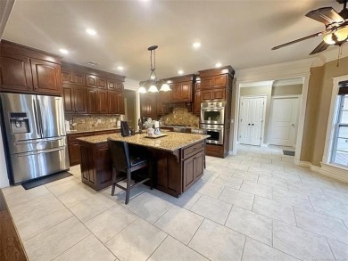 Luxurious 6 bedroom, 4.5 bath home on the 5th hole of Riverlinks on Tahlequah City Golf Course in Oklahoma - for sale on GolfHomes.com, golf home, golf lot