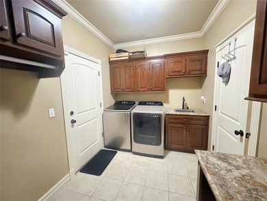 Luxurious 6 bedroom, 4.5 bath home on the 5th hole of Riverlinks on Tahlequah City Golf Course in Oklahoma - for sale on GolfHomes.com, golf home, golf lot