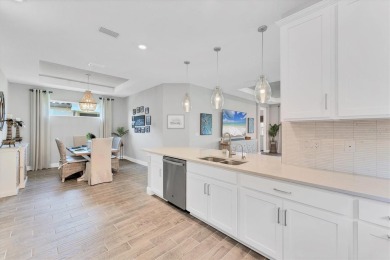Step into paradise at 3025 Veneto Court, an upgraded on Esplanade Golf and Country at Lakewood Ranch in Florida - for sale on GolfHomes.com, golf home, golf lot
