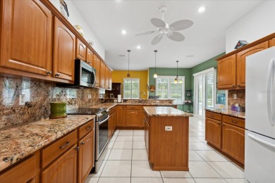 Discover the potential of this charming 3 bed, 3 bath pool home on The Grand Club Cypress Course in Florida - for sale on GolfHomes.com, golf home, golf lot