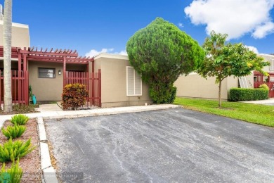 Welcome to this exceptional corner townhouse in the heart of on Pembroke Lakes Golf Club in Florida - for sale on GolfHomes.com, golf home, golf lot