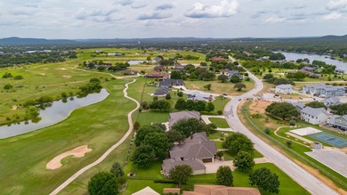 Nestled beneath an abundance of shade, located across the street on Legends Golf Course in Texas - for sale on GolfHomes.com, golf home, golf lot