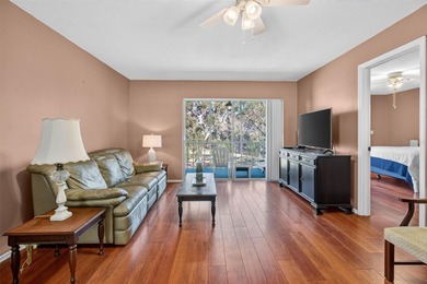 Relax and enjoy the serene views from your screened on East Lake Woodlands Country Club in Florida - for sale on GolfHomes.com, golf home, golf lot