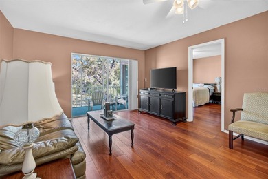 Relax and enjoy the serene views from your screened on East Lake Woodlands Country Club in Florida - for sale on GolfHomes.com, golf home, golf lot