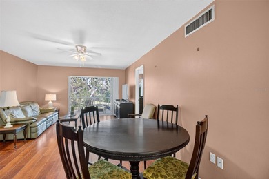 Relax and enjoy the serene views from your screened on East Lake Woodlands Country Club in Florida - for sale on GolfHomes.com, golf home, golf lot