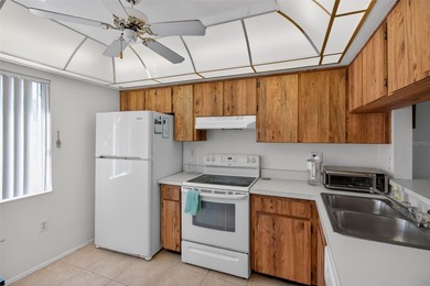 Relax and enjoy the serene views from your screened on East Lake Woodlands Country Club in Florida - for sale on GolfHomes.com, golf home, golf lot