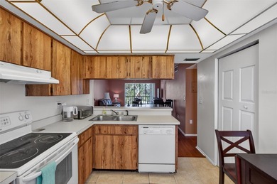 Relax and enjoy the serene views from your screened on East Lake Woodlands Country Club in Florida - for sale on GolfHomes.com, golf home, golf lot