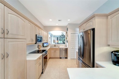 Well-maintained golf cottage offers privacy inside and out on Oak Harbor Country Club in Florida - for sale on GolfHomes.com, golf home, golf lot