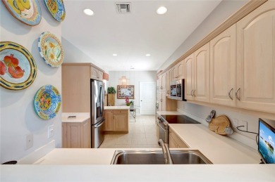 Well-maintained golf cottage offers privacy inside and out on Oak Harbor Country Club in Florida - for sale on GolfHomes.com, golf home, golf lot
