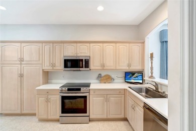 Well-maintained golf cottage offers privacy inside and out on Oak Harbor Country Club in Florida - for sale on GolfHomes.com, golf home, golf lot