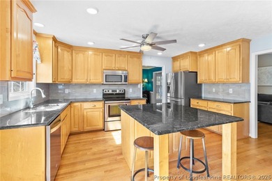 Welcome to this beautifully maintained 3 bedroom, 2 bath home on Cypress Lakes Golf Course in North Carolina - for sale on GolfHomes.com, golf home, golf lot