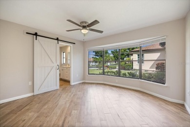 Step inside to discover a masterfully reimagined villa where on IMG Academies Golf and Country Club in Florida - for sale on GolfHomes.com, golf home, golf lot