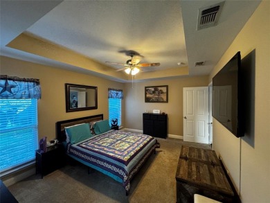 You'll find a wonderful escape from city life in this perfectly on Holly Lake Ranch Golf Club in Texas - for sale on GolfHomes.com, golf home, golf lot