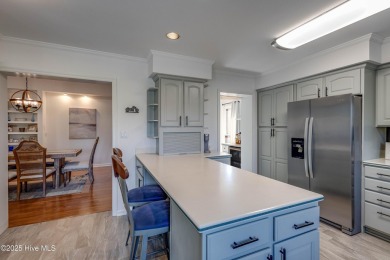 Welcome to 6106 Cutlass Court, a charming brick ranch-style home on Harbour Point Golf Club in North Carolina - for sale on GolfHomes.com, golf home, golf lot
