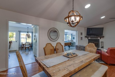 Welcome to 6106 Cutlass Court, a charming brick ranch-style home on Harbour Point Golf Club in North Carolina - for sale on GolfHomes.com, golf home, golf lot