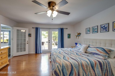 Welcome to 6106 Cutlass Court, a charming brick ranch-style home on Harbour Point Golf Club in North Carolina - for sale on GolfHomes.com, golf home, golf lot