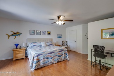 Welcome to 6106 Cutlass Court, a charming brick ranch-style home on Harbour Point Golf Club in North Carolina - for sale on GolfHomes.com, golf home, golf lot