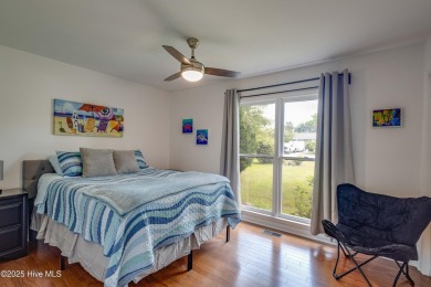 Welcome to 6106 Cutlass Court, a charming brick ranch-style home on Harbour Point Golf Club in North Carolina - for sale on GolfHomes.com, golf home, golf lot