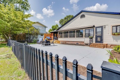 Welcome to 6106 Cutlass Court, a charming brick ranch-style home on Harbour Point Golf Club in North Carolina - for sale on GolfHomes.com, golf home, golf lot