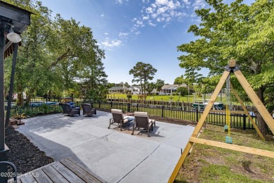 Welcome to 6106 Cutlass Court, a charming brick ranch-style home on Harbour Point Golf Club in North Carolina - for sale on GolfHomes.com, golf home, golf lot