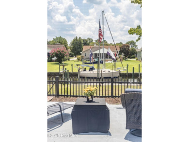Welcome to 6106 Cutlass Court, a charming brick ranch-style home on Harbour Point Golf Club in North Carolina - for sale on GolfHomes.com, golf home, golf lot