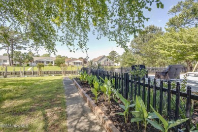 Welcome to 6106 Cutlass Court, a charming brick ranch-style home on Harbour Point Golf Club in North Carolina - for sale on GolfHomes.com, golf home, golf lot