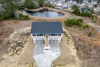 Welcome to 318 Landon Lane in Marsh Haven Landing, your on North Shore Country Club in North Carolina - for sale on GolfHomes.com, golf home, golf lot