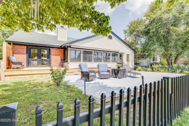 Welcome to 6106 Cutlass Court, a charming brick ranch-style home on Harbour Point Golf Club in North Carolina - for sale on GolfHomes.com, golf home, golf lot