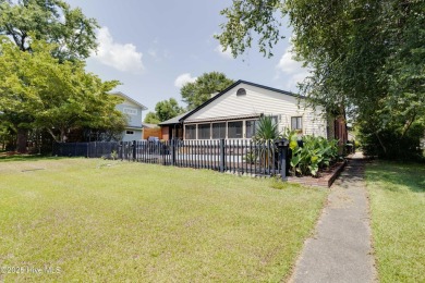 Welcome to 6106 Cutlass Court, a charming brick ranch-style home on Harbour Point Golf Club in North Carolina - for sale on GolfHomes.com, golf home, golf lot