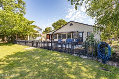 Welcome to 6106 Cutlass Court, a charming brick ranch-style home on Harbour Point Golf Club in North Carolina - for sale on GolfHomes.com, golf home, golf lot