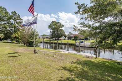 Welcome to 6106 Cutlass Court, a charming brick ranch-style home on Harbour Point Golf Club in North Carolina - for sale on GolfHomes.com, golf home, golf lot