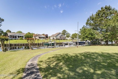 Welcome to 6106 Cutlass Court, a charming brick ranch-style home on Harbour Point Golf Club in North Carolina - for sale on GolfHomes.com, golf home, golf lot