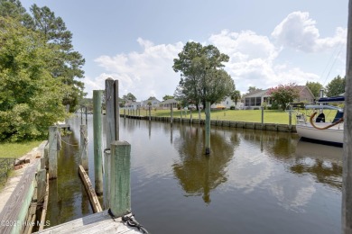 Welcome to 6106 Cutlass Court, a charming brick ranch-style home on Harbour Point Golf Club in North Carolina - for sale on GolfHomes.com, golf home, golf lot