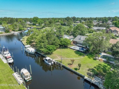 Welcome to 6106 Cutlass Court, a charming brick ranch-style home on Harbour Point Golf Club in North Carolina - for sale on GolfHomes.com, golf home, golf lot