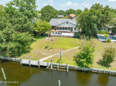 Welcome to 6106 Cutlass Court, a charming brick ranch-style home on Harbour Point Golf Club in North Carolina - for sale on GolfHomes.com, golf home, golf lot