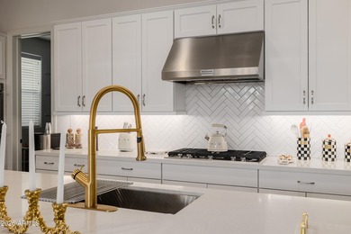 Indulge in refined luxury in this extraordinary Toll Brothers on Sterling Grove Golf & Country Club in Arizona - for sale on GolfHomes.com, golf home, golf lot