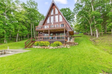 Welcome to your dream Lodge-like home nestled on a sprawling on Raintree Country Club in Missouri - for sale on GolfHomes.com, golf home, golf lot