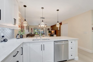 Experience breathtaking lakefront living in this stunning on Boca Lago Golf and Country Club in Florida - for sale on GolfHomes.com, golf home, golf lot