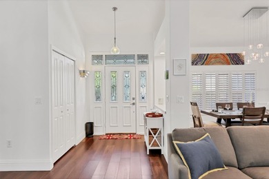 Walk through the front gate and courtyard to discover refined on The Meadows Golf and Country Club in Florida - for sale on GolfHomes.com, golf home, golf lot