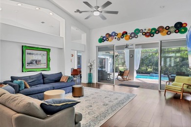 Walk through the front gate and courtyard to discover refined on The Meadows Golf and Country Club in Florida - for sale on GolfHomes.com, golf home, golf lot