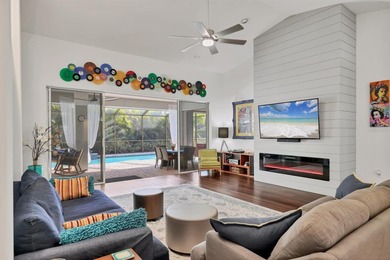 Walk through the front gate and courtyard to discover refined on The Meadows Golf and Country Club in Florida - for sale on GolfHomes.com, golf home, golf lot