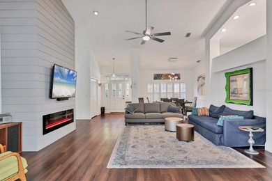 Walk through the front gate and courtyard to discover refined on The Meadows Golf and Country Club in Florida - for sale on GolfHomes.com, golf home, golf lot