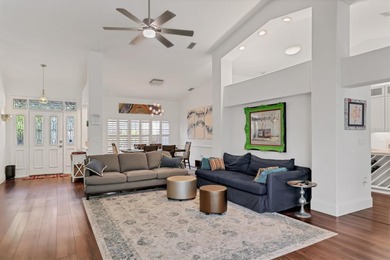 Walk through the front gate and courtyard to discover refined on The Meadows Golf and Country Club in Florida - for sale on GolfHomes.com, golf home, golf lot