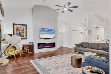 Walk through the front gate and courtyard to discover refined on The Meadows Golf and Country Club in Florida - for sale on GolfHomes.com, golf home, golf lot